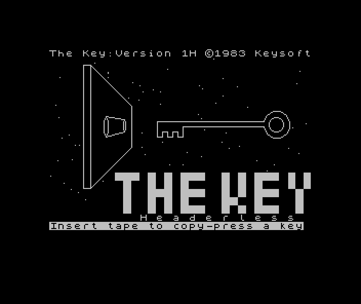 The Key loading screen: a stylised key and keyhole graphic above the title "THE KEY: Headerless" and the prompt "Insert tape to copy - press a key"