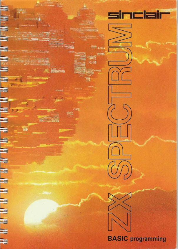 Cover of the orange Sinclair ZX Spectrum BASIC Programming manual, showing a glowing cityscape at sunset with the title in large outlined letters