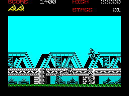 Green Beret in-game screen: monochrome soldier sprite on a bridge structure against a cyan sky, with score and stage counters at the top