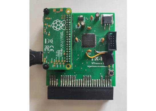 An assembled TK-Pie board: a Raspberry Pi Zero mounted on a green PCB with a CPLD, JTAG header, and the ZX Spectrum edge connector along the bottom